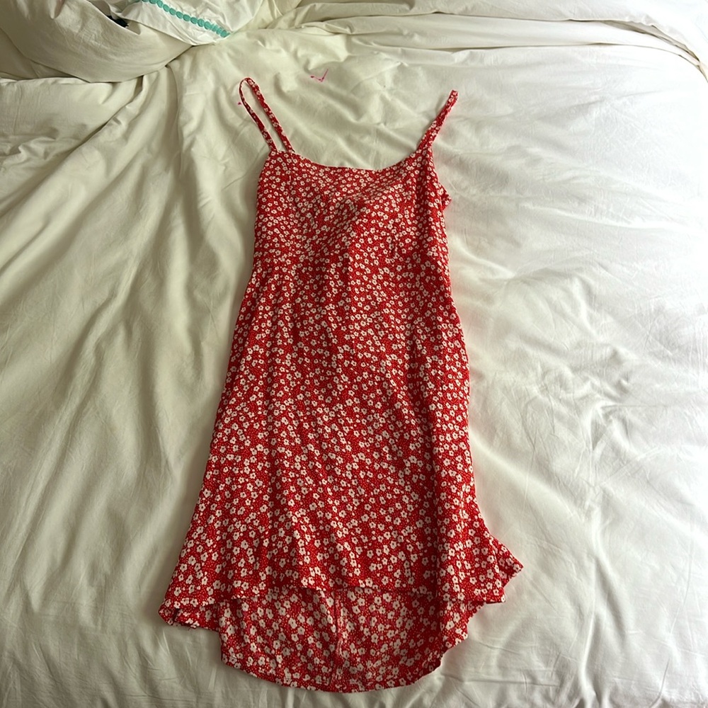 A red flower dress opened in the back with a bow. Size extra small. Summer dress